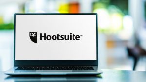 laptop with a hootsuite logo on its screen